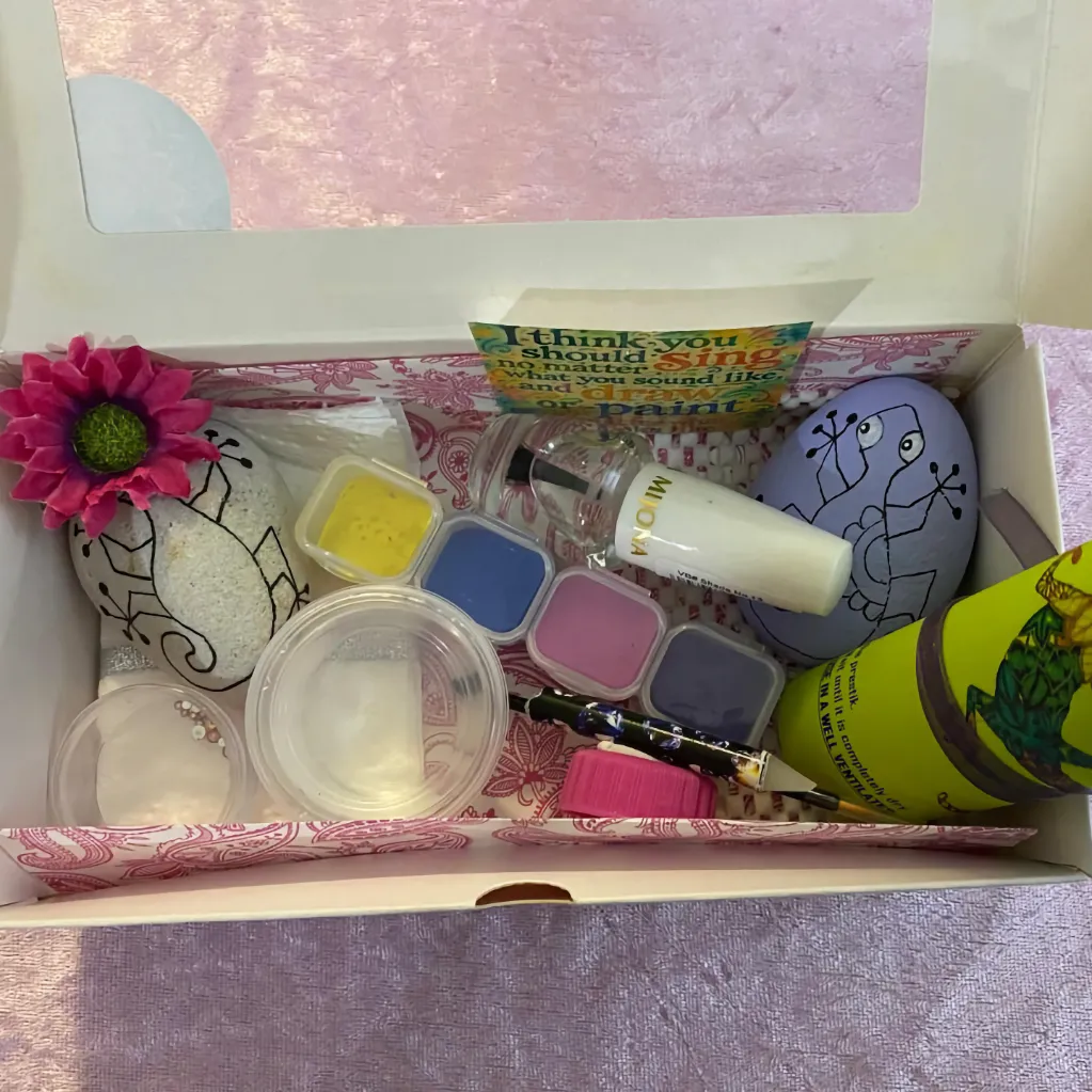 Painting pack opened to show the contents of a painting pack used for class lessons, private lessons, and paint-at-home customers